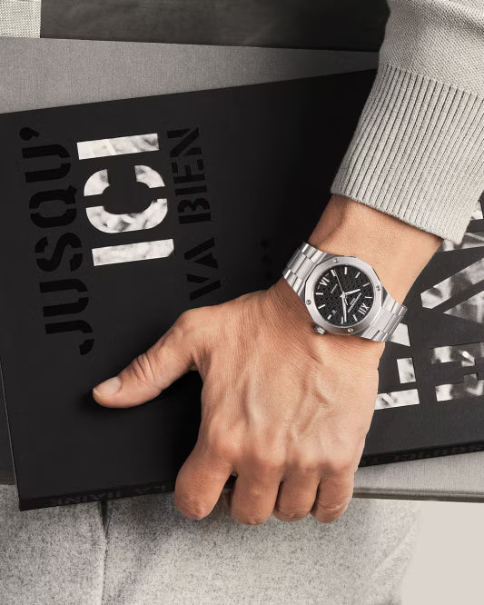 Riviera 10621 42mm Steel Case, Dodecagonal Steel Bezel, Exhibition Back, Automatic, Black Dial, Steel Bracelet